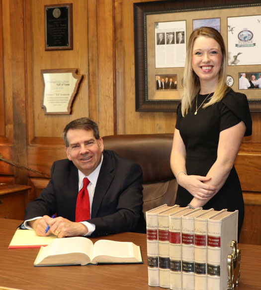 Attorney sitting on a chair and smiling